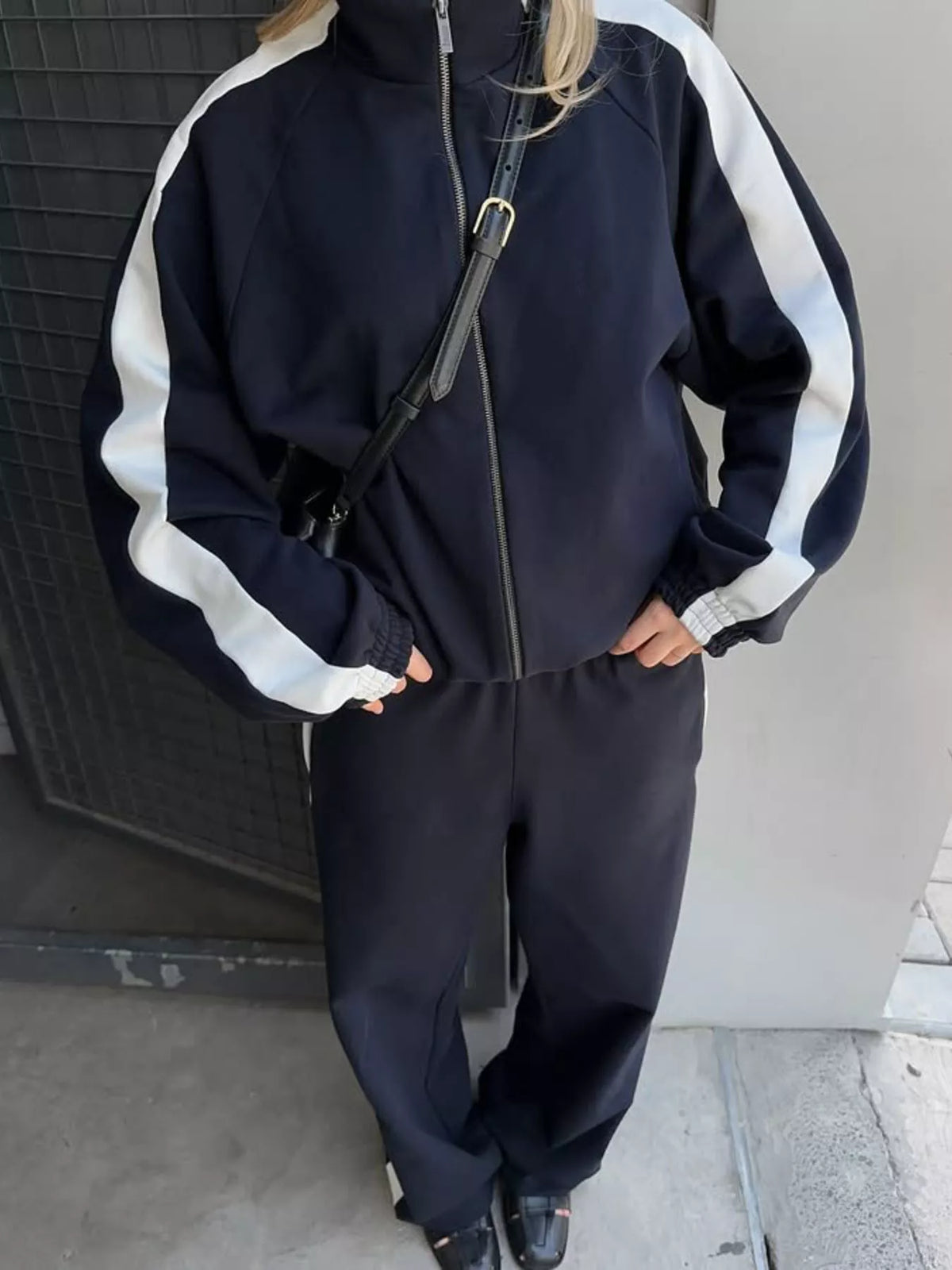 Plush Fashion Hub zip-up long sleeve tracksuit set in soft fabric, featuring a comfortable fit and stylish design.