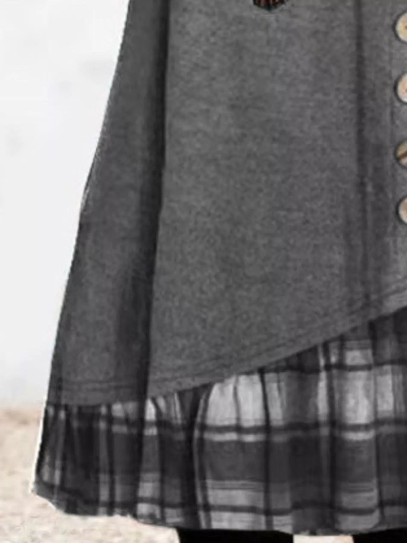 Plus size asymmetrical plaid patchwork long sleeve dress by Trendsi, featuring a stylish full-length design with a mixed plaid pattern.
