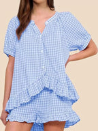 Gingham ruffle trim top and shorts set by Trendsi, featuring a stylish matching design with ruffled details and classic gingham pattern.