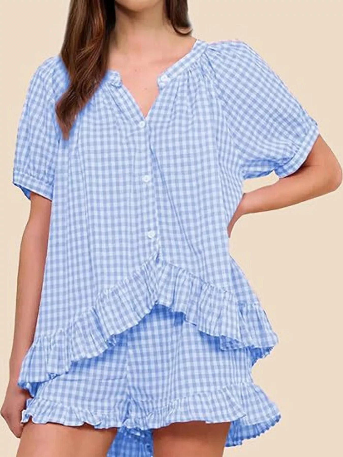 Gingham ruffle trim top and shorts set by Trendsi, featuring a stylish matching design with ruffled details and classic gingham pattern.