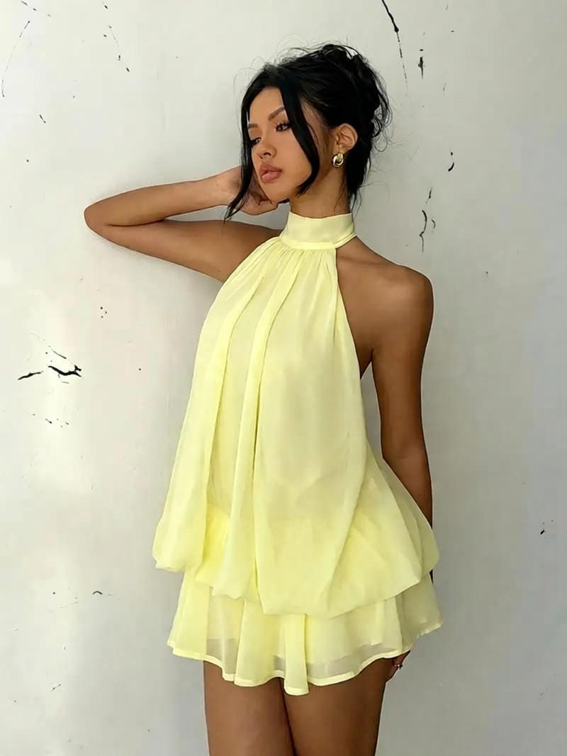 Women's chiffon halter mini dress by Plush Fashion Hub featuring a high-waist, open-back, and A-line silhouette.