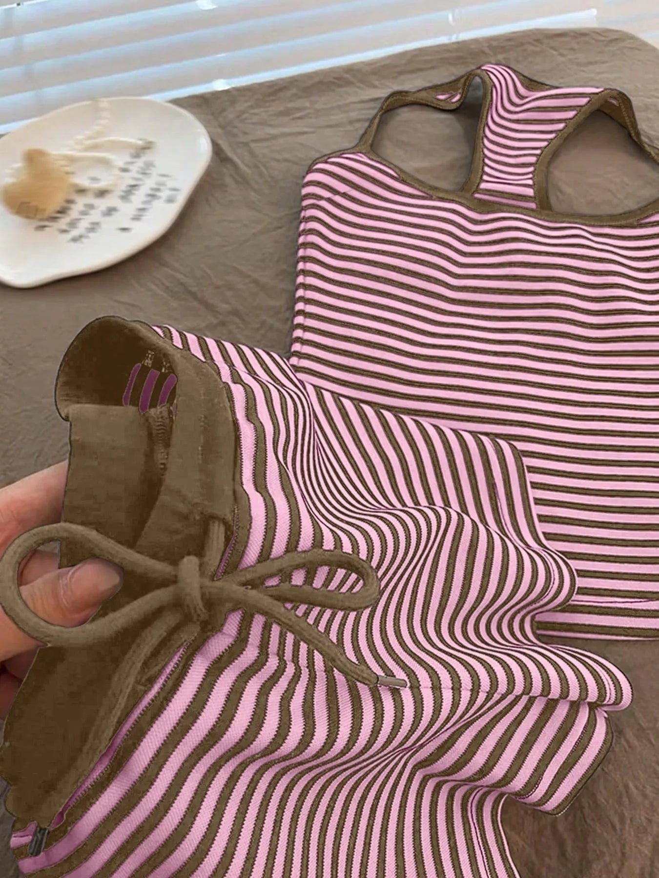 Striped tank top and shorts set by Trendsi featuring a casual, stylish design with a sleeveless tank top and matching shorts.