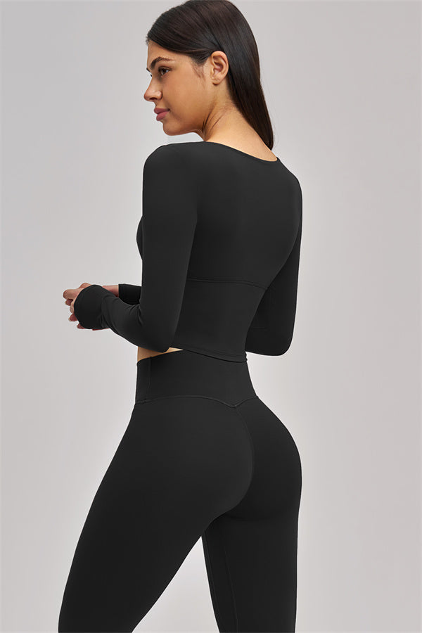 Fitglutes Activewear long sleeve crop top with fitted design, shown in black, suitable for gym, sports, and workout activities.