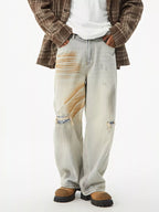 Men's distressed wide leg jeans by Trendsi featuring a relaxed fit and faded, ripped details on denim fabric.