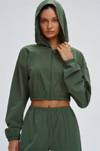 Fitglutes Activewear UV protection crop hoodie with long sleeves, lightweight fabric, and snug fit for workout and outdoor activities.