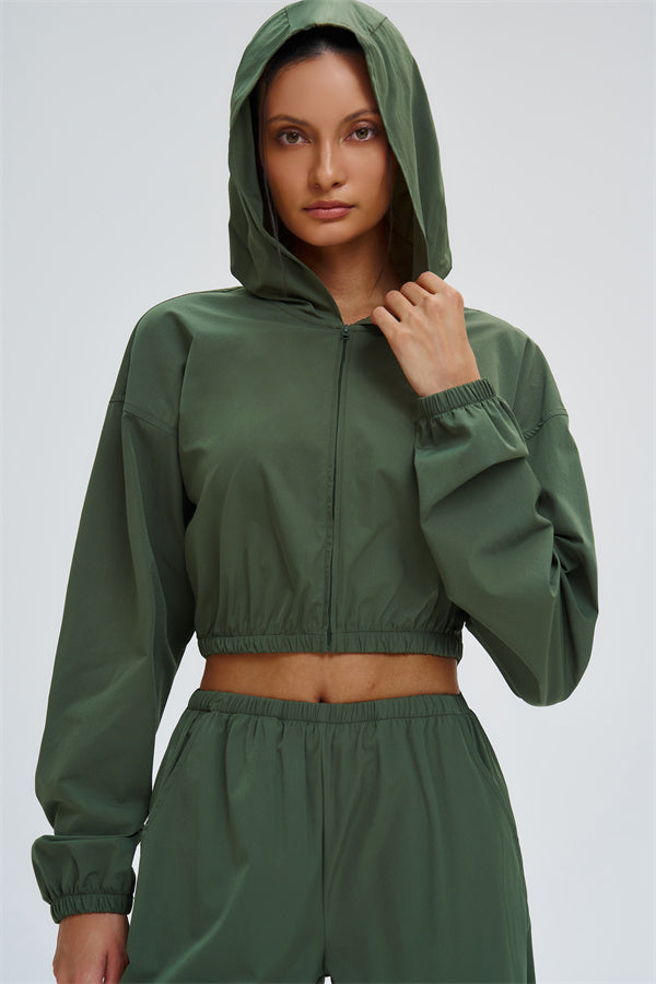 Fitglutes Activewear UV protection crop hoodie with long sleeves, lightweight fabric, and snug fit for workout and outdoor activities.