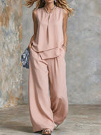 Women's sleeveless two-piece set from Plush Fashion Hub featuring solid color wide-leg pants and matching top.