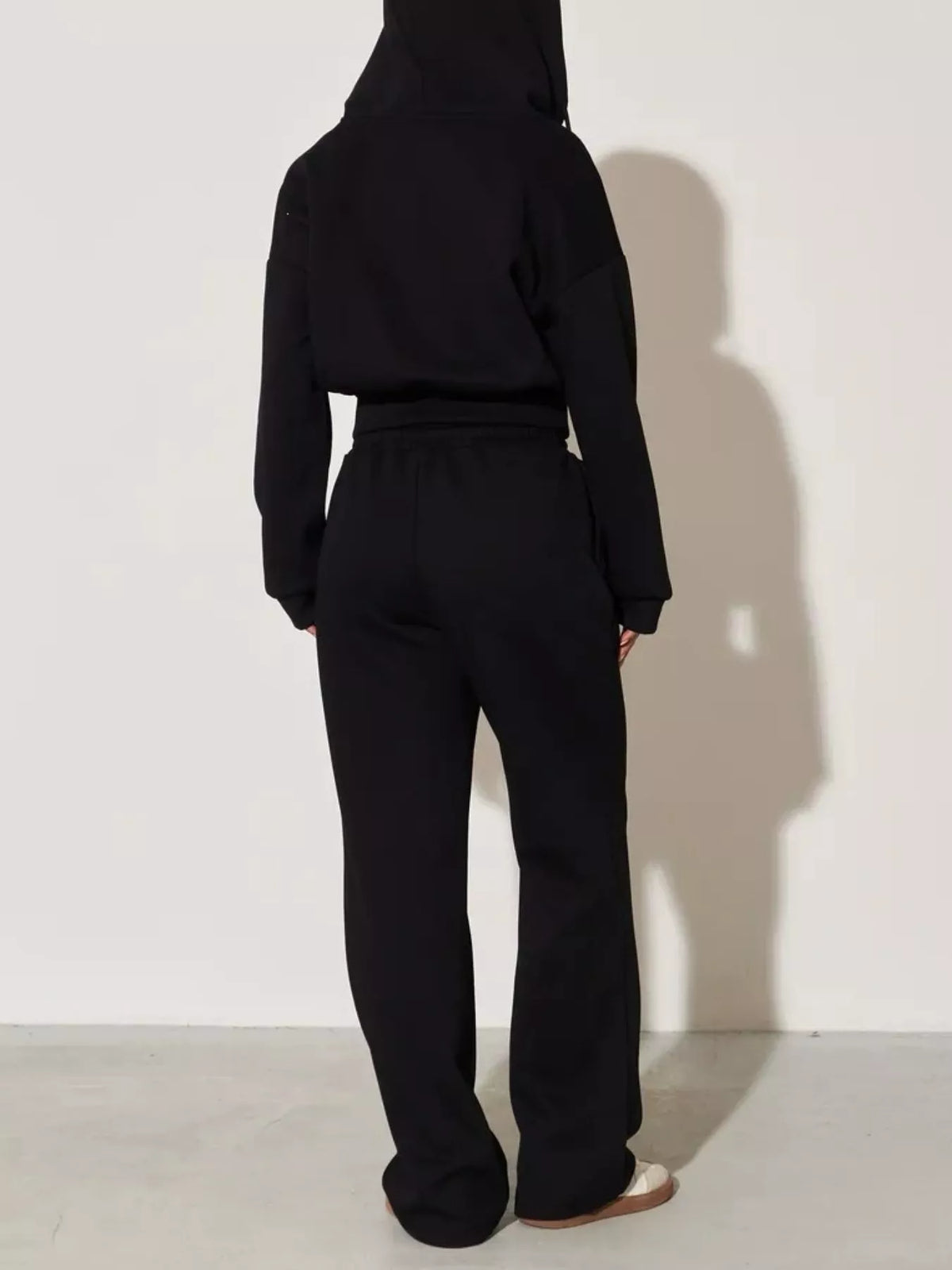 Plush Fashion Hub zip-up hoodie and wide-leg pants loungewear set, featuring comfortable fabric and casual style.