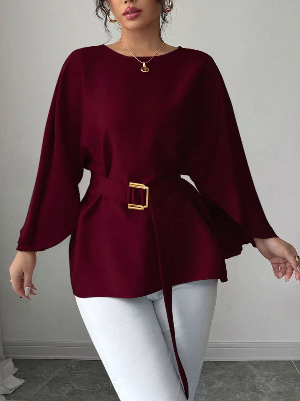 Black batwing sleeve belted blouse from Shopimist, featuring a stylish relaxed fit and waist belt, displayed on a hanger.