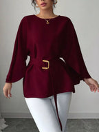 Black batwing sleeve belted blouse from Shopimist, featuring a stylish relaxed fit and waist belt, displayed on a hanger.