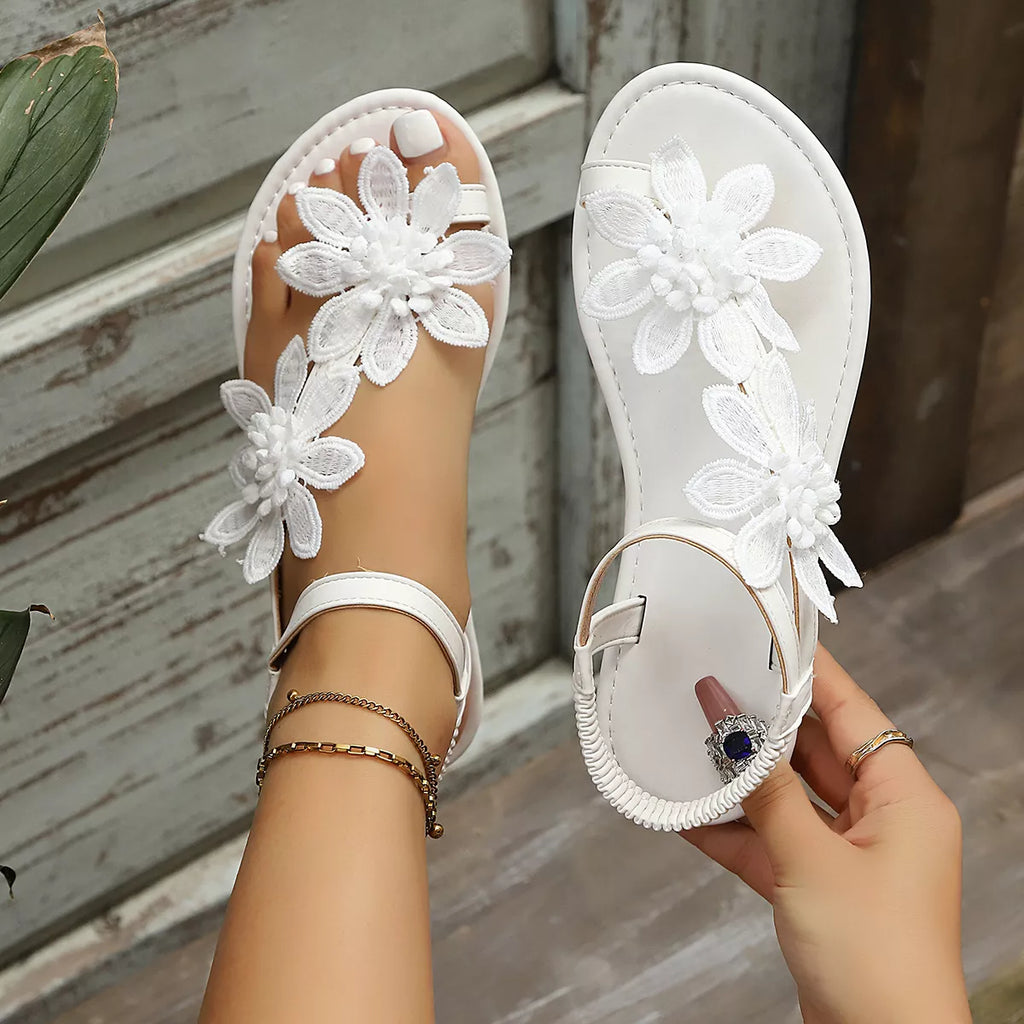 Floral embellished flat sandals by Shopimist featuring colorful flower details and open toe design for casual summer wear.