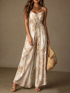 Women's printed backless camisole wide-leg jumpsuit from Plush Fashion Hub, featuring a stylish backless design and comfortable wide-leg fit.