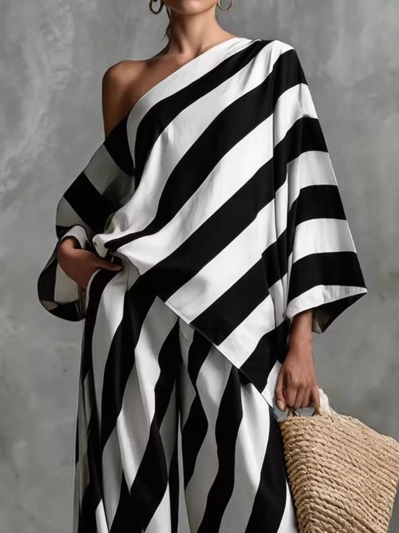 Plus size full size striped one-shoulder top and wide-leg pants set by Plush Fashion Hub, casual stylish women's outfit