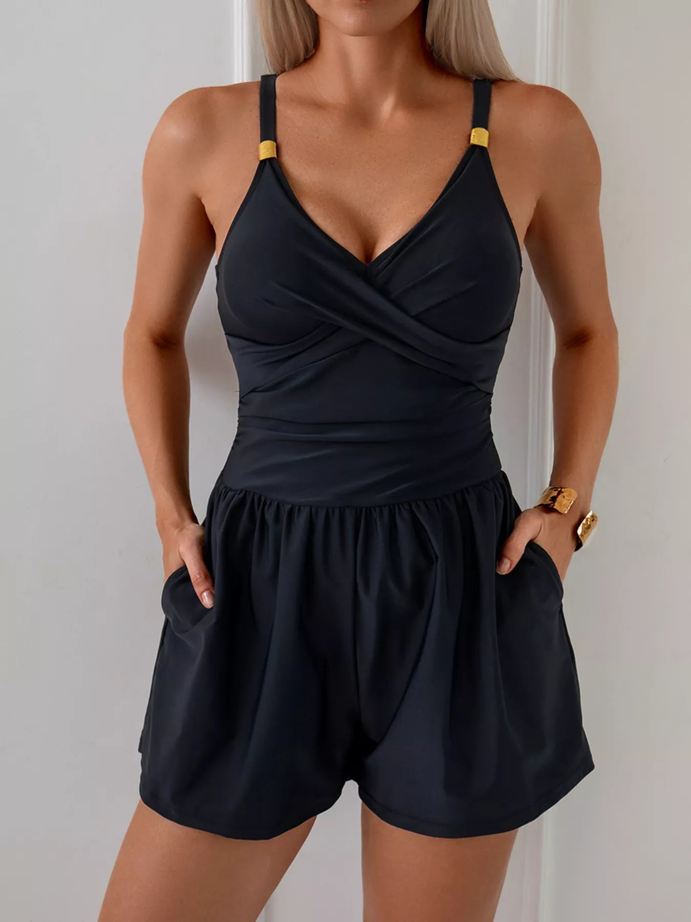 Women's V-neck spaghetti strap one-piece swimsuit by Trendsi, featuring stretchy beachwear fabric and a flattering fit.