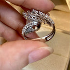 Sterling silver bypass ring with a pearl accent, crafted by Shopimist, showcasing a sleek and elegant design.