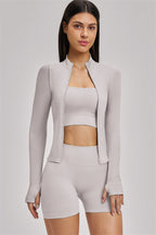 Fitglutes Activewear three-piece set featuring a sports bra, jacket, and shorts for gym and workout activities.