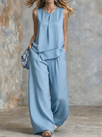Women's sleeveless two-piece set with solid color wide-leg pants and top, stylish and comfortable from Plush Fashion Hub.