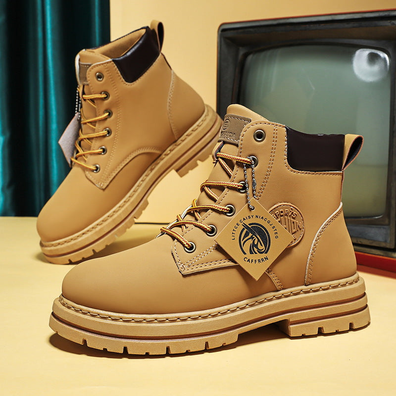 Tan leather ankle boots with dark brown cuffs, yellow laces, thick treaded soles, and a hanging logo tag.