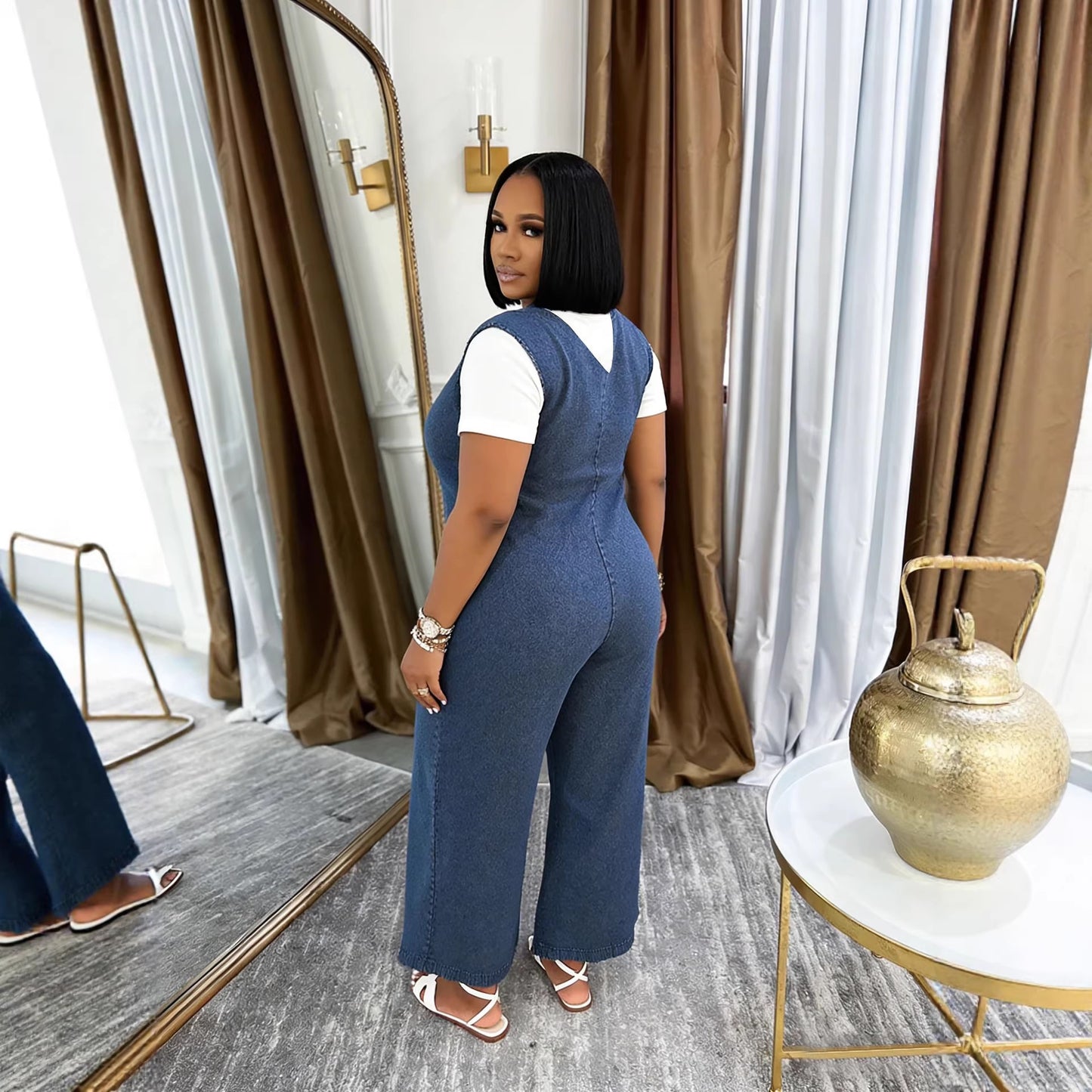 Washed denim V-neck casual jumpsuit with side pockets, from Plush Fashion Hub, featuring a relaxed fit and comfortable style.