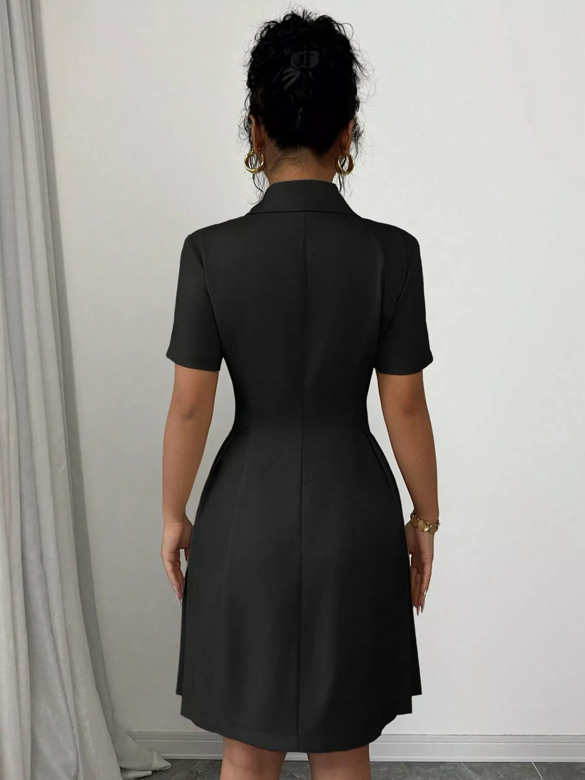 Plush Fashion Hub double-breasted pleated blazer dress featuring structured design and classic lapels, shown on a mannequin.