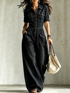 Full size denim wide-leg jumpsuit with chest pockets, plus size trendy jumpsuit from Trendsi, shown on a model.