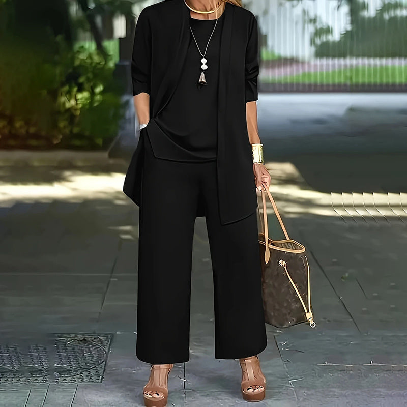 Women's plus size casualwear lounge set by FitiqueFit with cardigan, vest, and wide-leg pants, shown laid out flat.