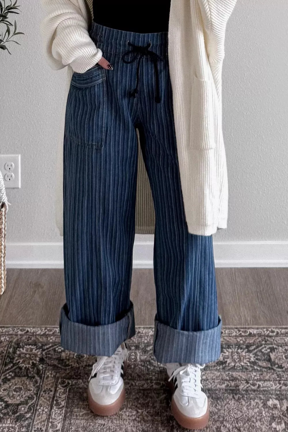 Striped wide-leg denim jeans by Plush Fashion Shop featuring a relaxed fit and bold horizontal stripe pattern.