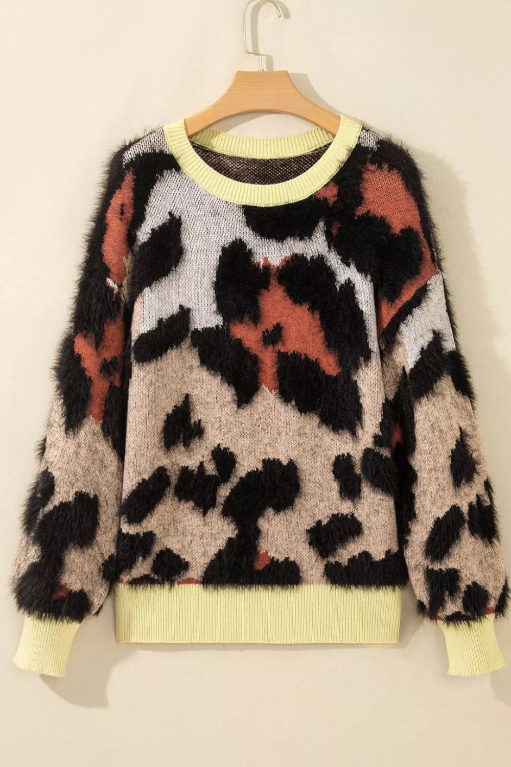 Leopard print drop shoulder long sleeve round neck sweater by Trendsi, featuring a cozy fit and stylish animal print pattern.