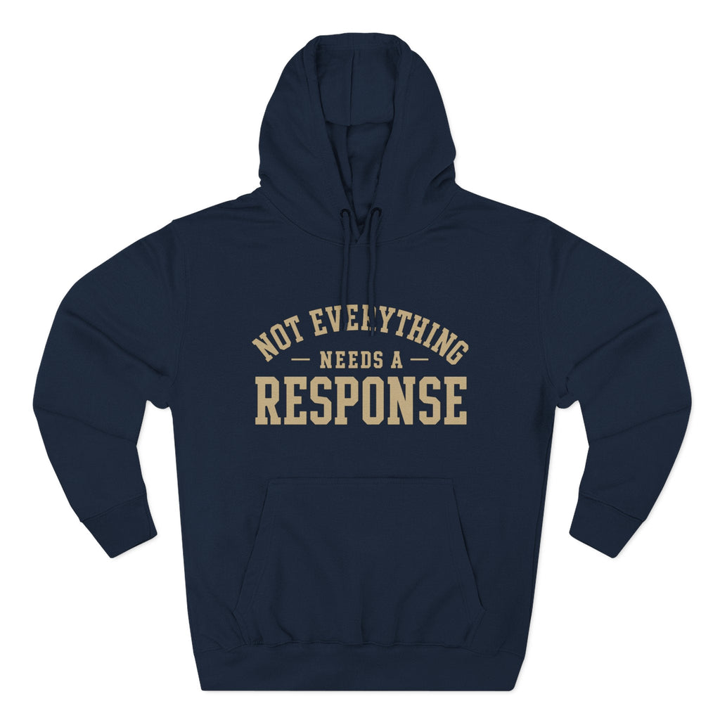 Black "Not Everything Needs a Response" hoodie by Wear Your Worship from the SEEN. Identity Line, featuring bold text on the front.
