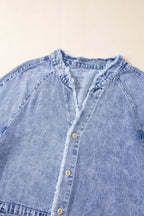 VYSN raw hem button-down long sleeve denim dress hanging on a rack, showcasing casual fashion style and distressed details.