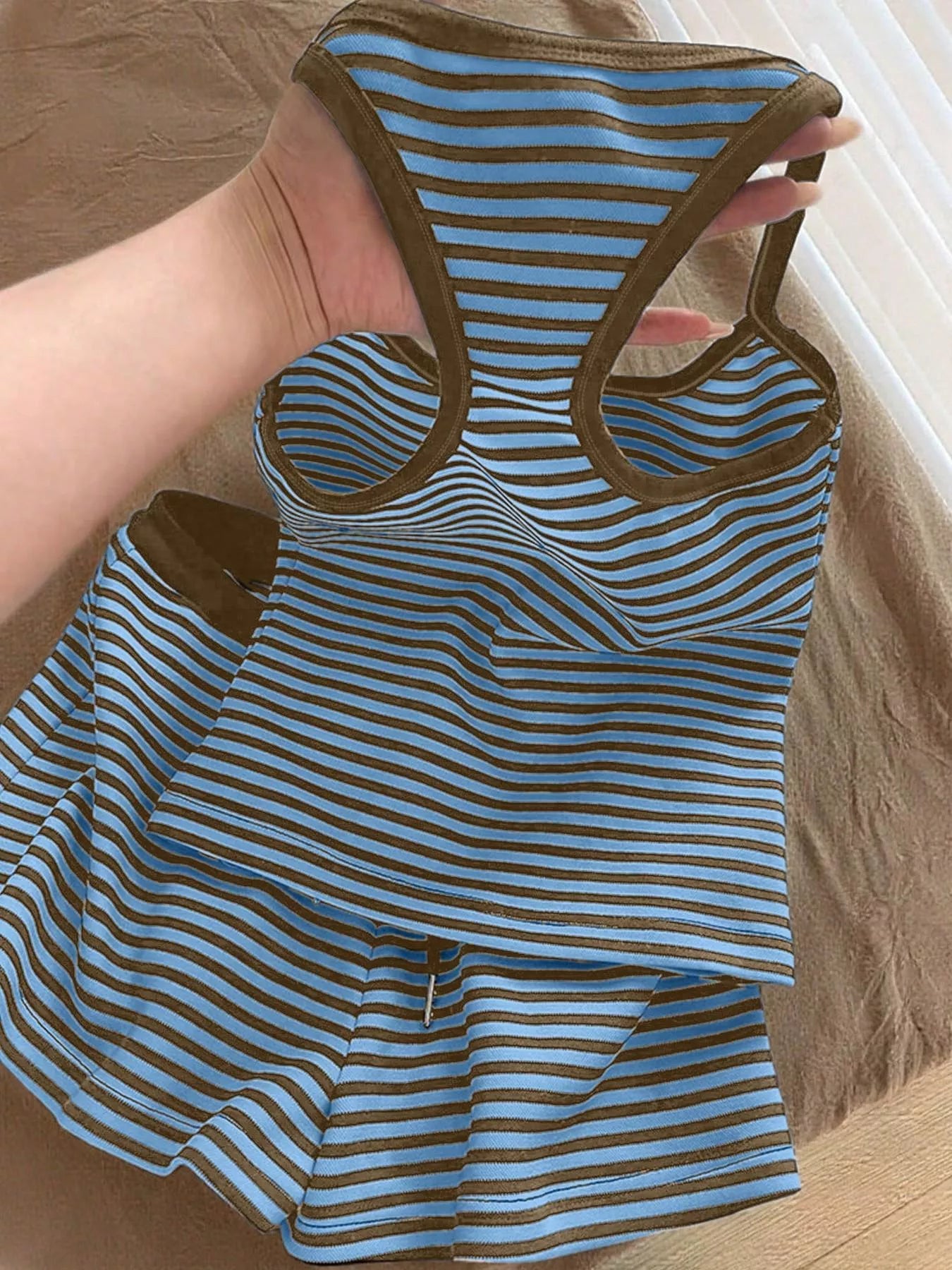 Striped tank top and shorts set from Trendsi featuring a casual, summery design with comfortable fabric and stylish striped pattern.