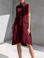 Plus size sleeveless button front dress by Shopimist, full-length dress with a stylish, sleeveless design and button details.