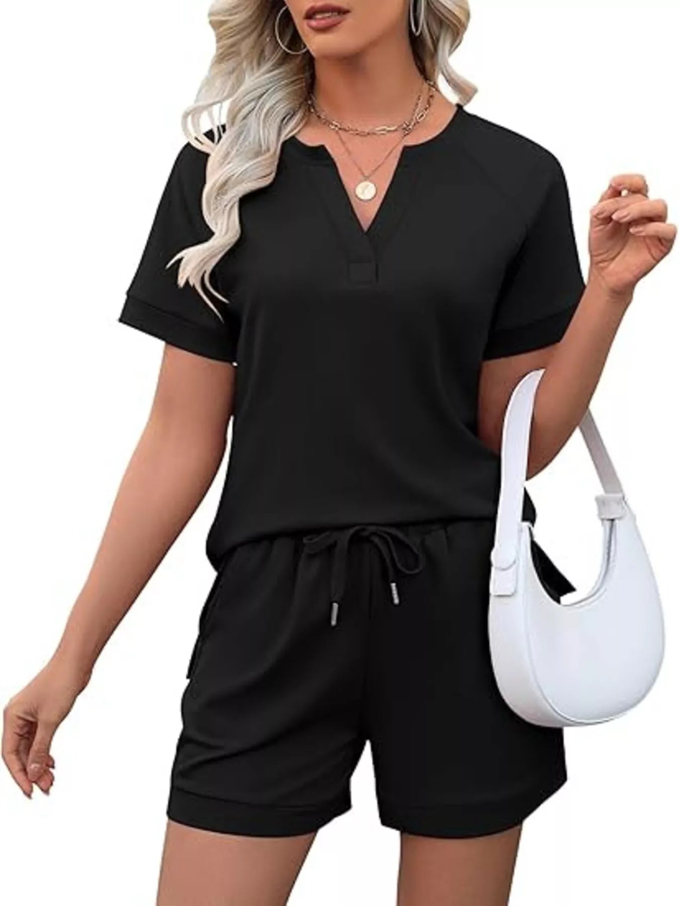 Solid color short sleeve top and shorts two-piece set by Trendsi, casual summer outfit with comfortable fabric and modern style.