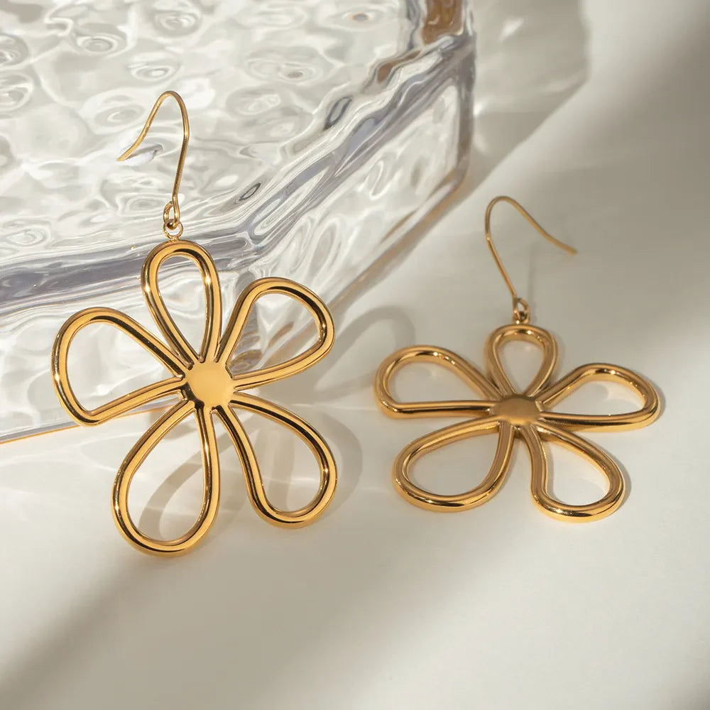 18K gold-plated flower earrings with intricate petal design, showcasing elegant floral jewelry from Shopimist.