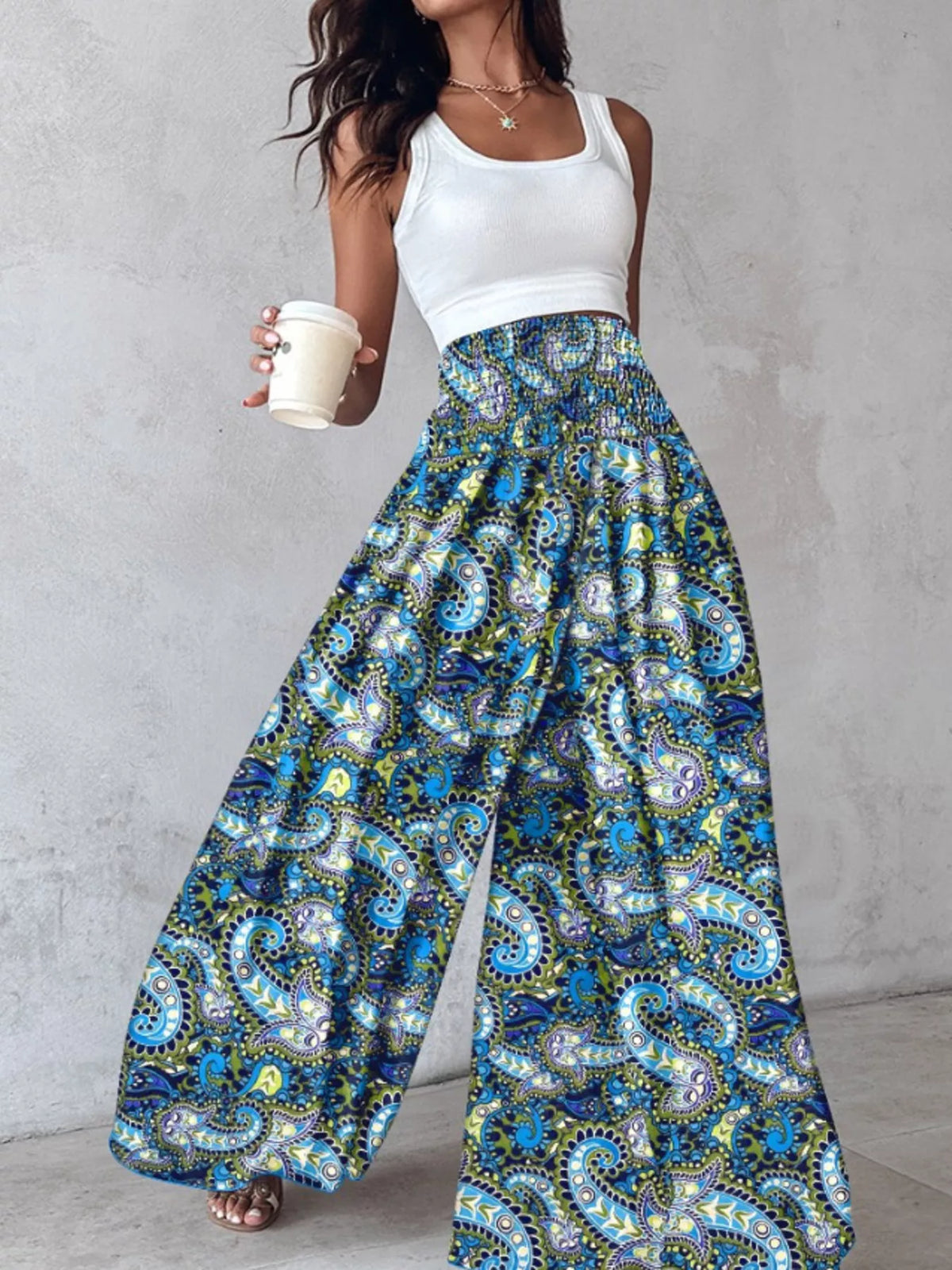 Printed wide-leg pants by Plush Fashion Hub featuring colorful floral patterns and a relaxed fit, stylish and comfortable for casual wear.
