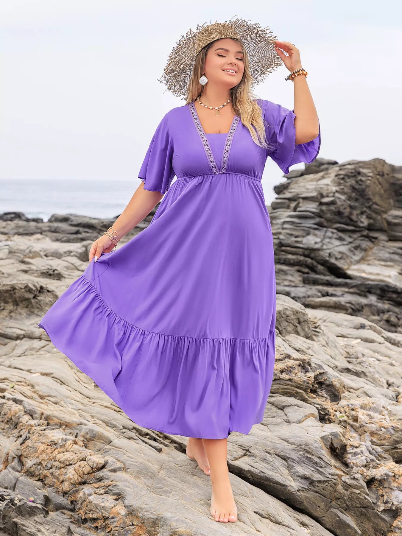 Plus size flutter sleeve tiered maxi dress by Shopimist, flowing fabric with layered tiers and flutter sleeves on a model.