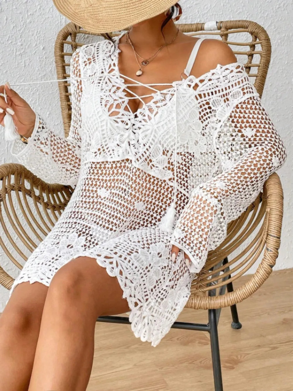 Long sleeve cutout tied V-neck cover-up dress by Trendsi, featuring a stylish design with open back and relaxed fit.