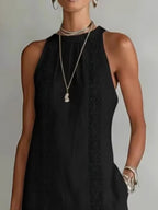 Sleeveless hollow-out midi dress with side slit and pockets by Plush Fashion Hub, featuring a stylish, modern design.