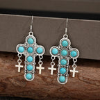Turquoise cross-shaped earrings by Shopimist featuring vibrant blue artificial turquoise stones and silver-tone metal.
