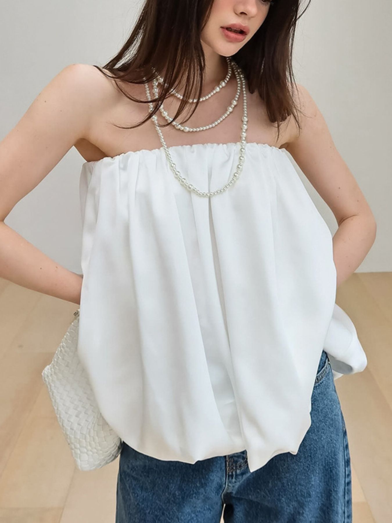 Women's strapless bubble hem tube top by Plush Fashion Hub, showing a sleek, minimalist crop top with a fitted silhouette and stylish design.