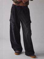 Women's drawstring waist cargo denim jeans with relaxed fit and utility style, featuring multiple pockets and casual design.