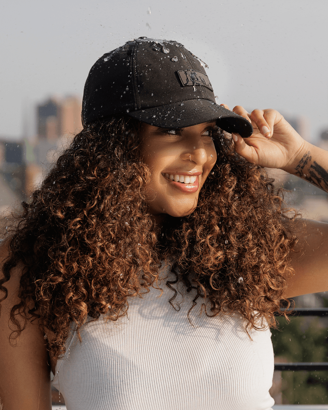Black waterproof satin-lined dad hat with adjustable strap, featuring a classic baseball cap style from Plush Fashion Hub.
