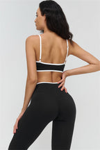 Fitglutes activewear Crave contrast sports bra and leggings 2-piece set featuring stylish black and white workout gear for fitness and gym.