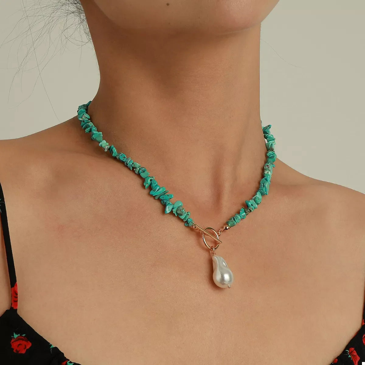 Turquoise irregular pearl necklace by Plush Fashion Hub featuring unique, uneven pearls on a stylish jewelry necklace.