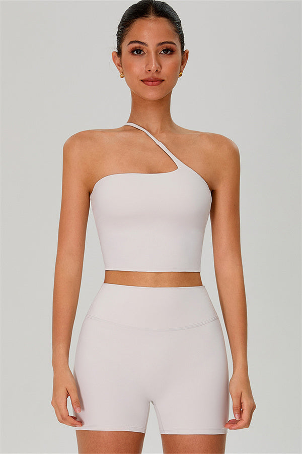 Fitglutes activewear one-shoulder crop top and shorts 2-piece set, stylish gymwear with a fitted design for workout or casual wear.
