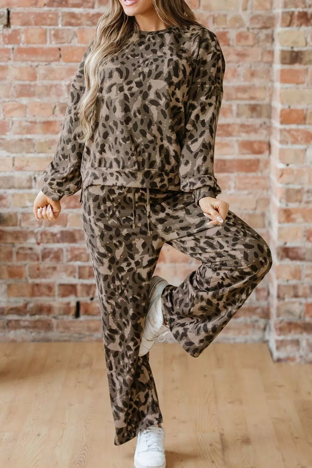 Leopard print long sleeve top and matching pants set by Trendsi, stylish animal print loungewear with a comfortable fit.