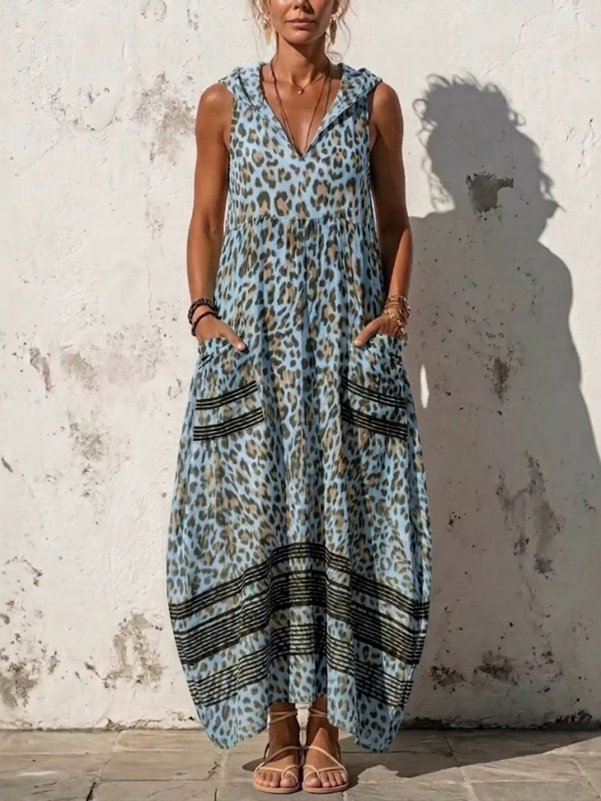 Plus size leopard print sleeveless hooded maxi dress with pockets, trendy and comfortable from Trendsi.