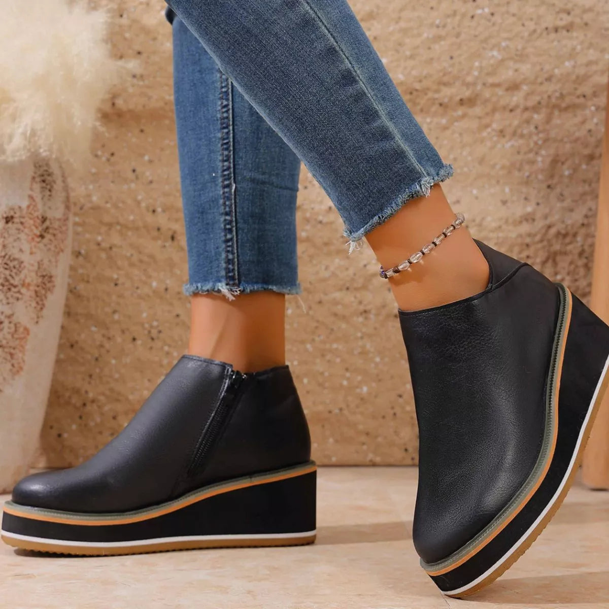 Women's round toe wedge ankle boots by Trendsi, featuring a stylish design with a comfortable wedge heel and ankle height.