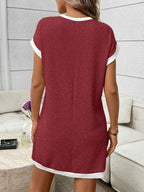 Ribbed knit mini dress with contrast trim and functional pocket, stylish dress by Trendsi, shown in a natural pose.