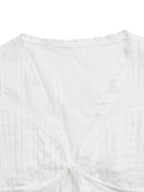 Lace trim tie-front sleeveless tank top from Plush Fashion Hub, featuring a fitted design and feminine lace details.